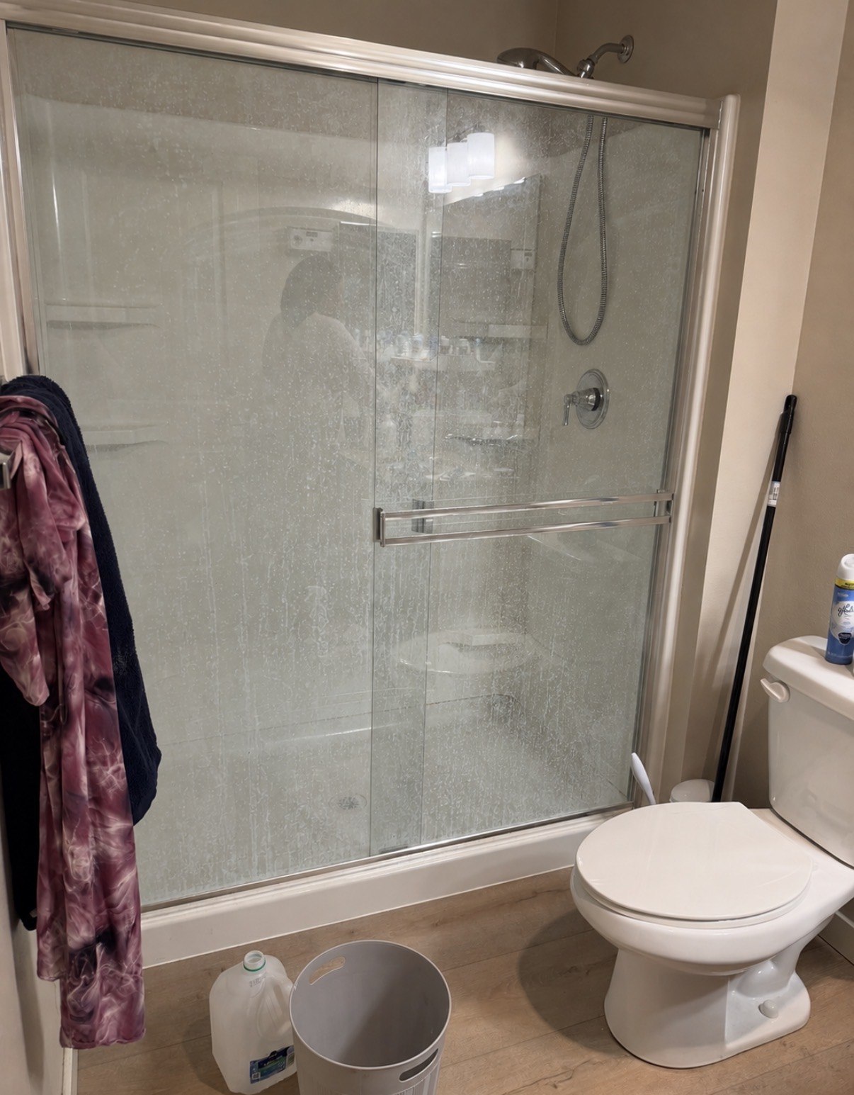 Shower glass & hard-water buildup before cleaning